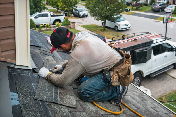 Professional Gutter Repair And Installation technician working in Middle Island, NY